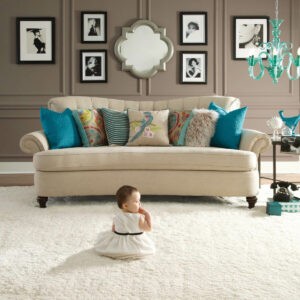 Cute baby sitting on carpet floor | Leon Country Floors & More | Sparta, WI